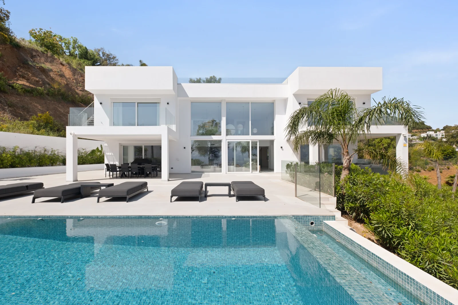 Buganville Villa exterior facade with infinity pool and sun terrace, La Mairena Marbella