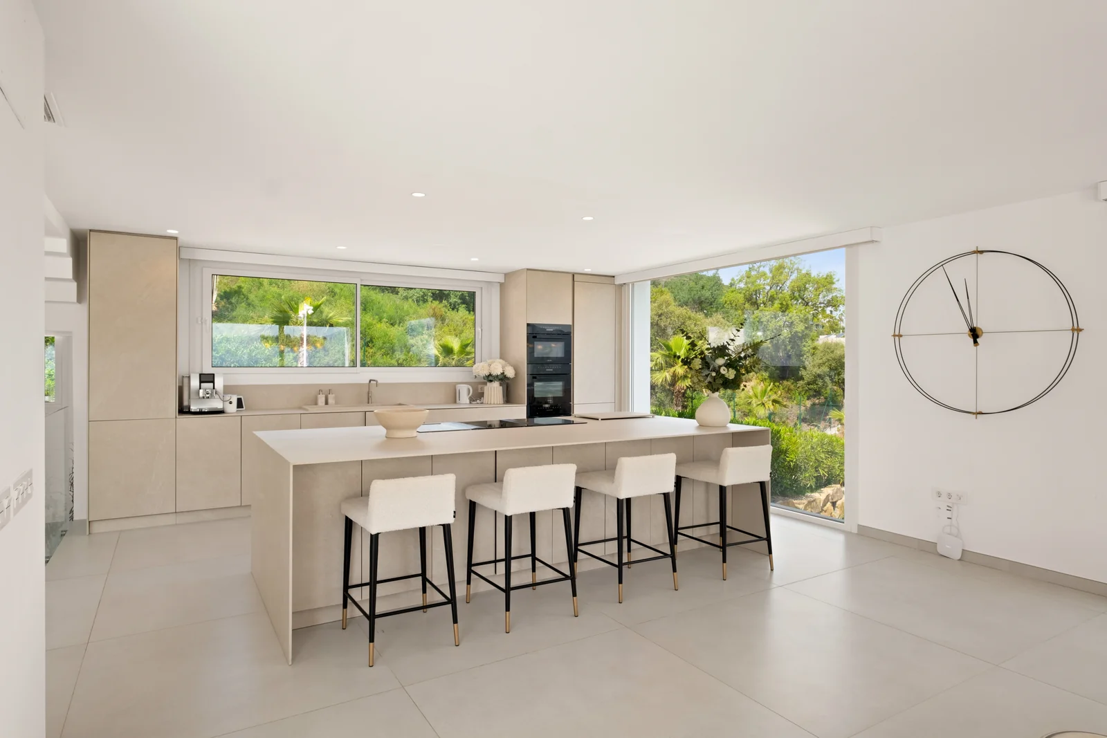 Buganville Villa kitchen island with breakfast bar seating and forest outlook