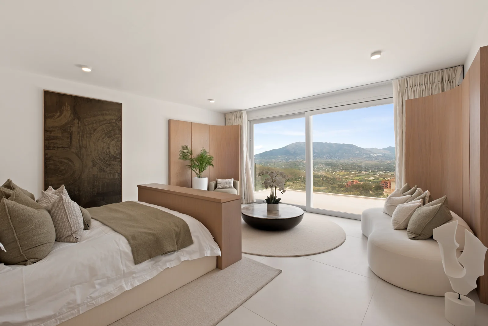 Buganville Villa master bedroom suite with lounge area and panoramic windows