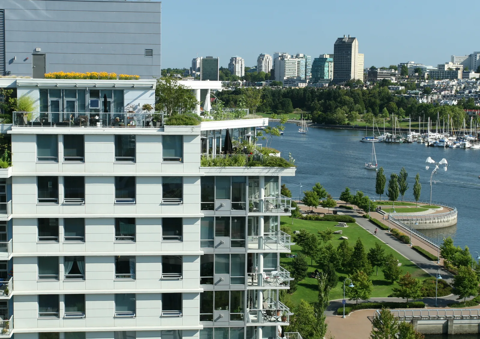 Waterfront luxury residential tower with terraced apartments, illustrating a clearly documented property listing