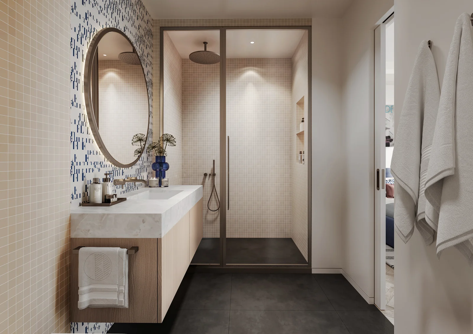 ELLE Residences Miami bathroom with oval mirror and walk-in shower