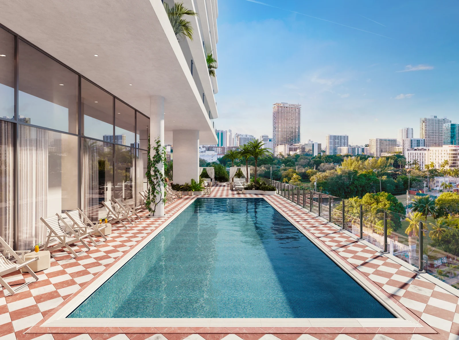 ELLE Residences Miami resort pool deck with chaise lounges and skyline