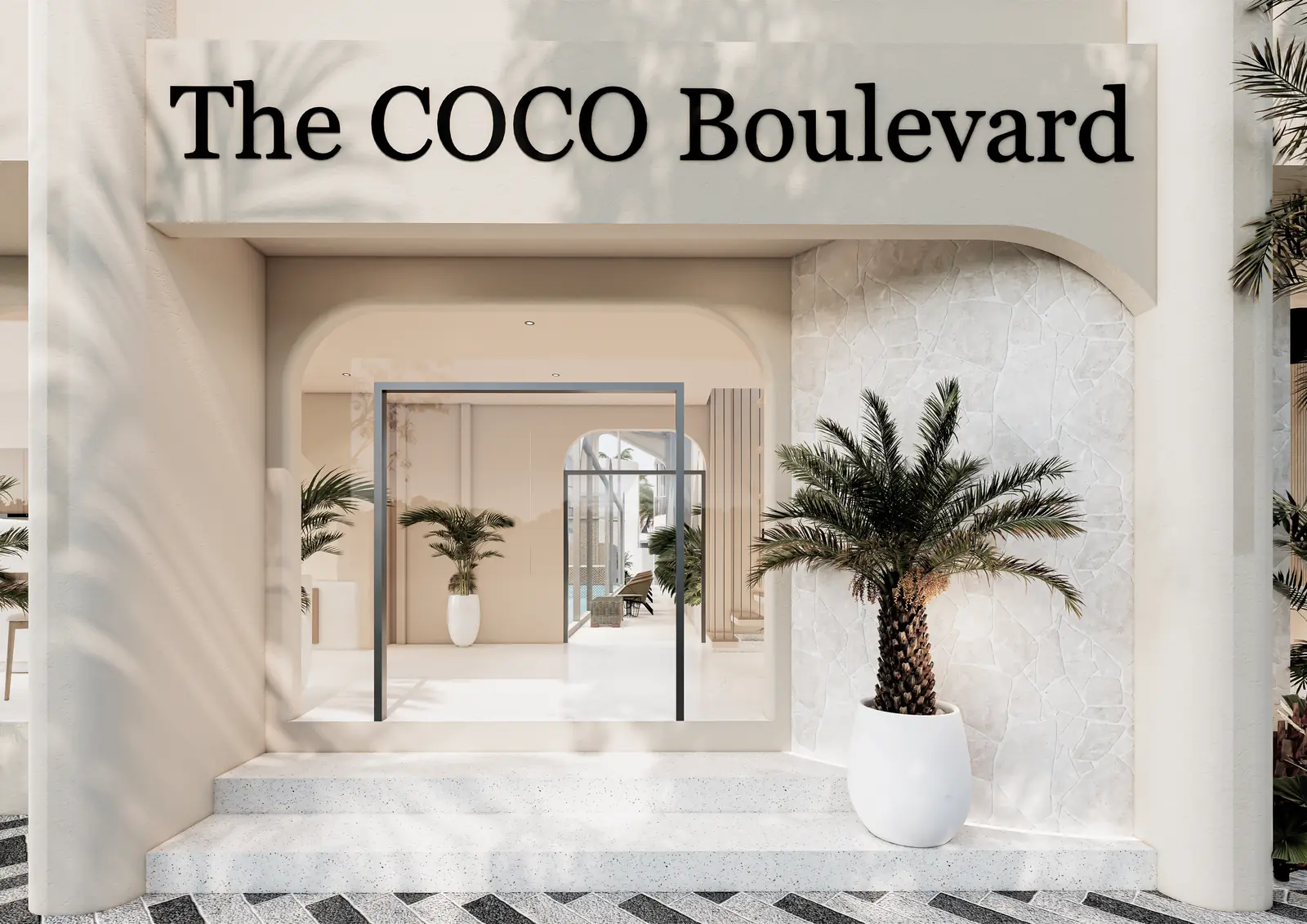 The Coco Boulevard arched entrance with signage and palms, Bingin, Uluwatu, Bali