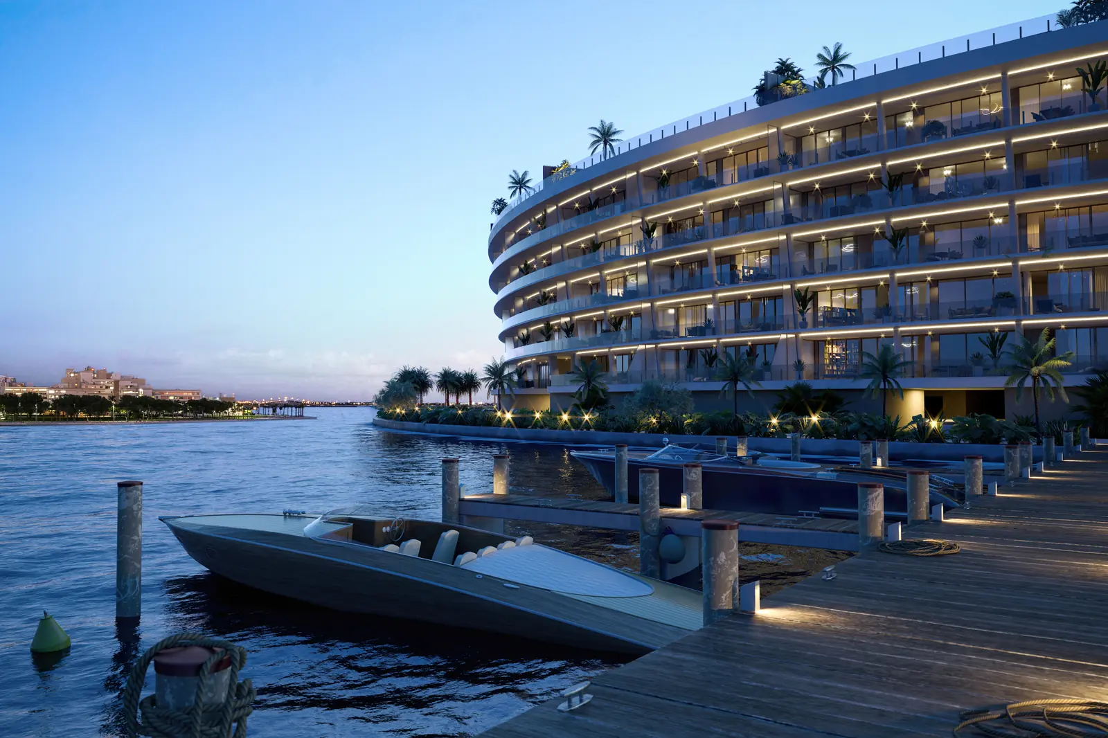 Vita at Grove Isle illuminated curved facade and marina at night, Coconut Grove Miami