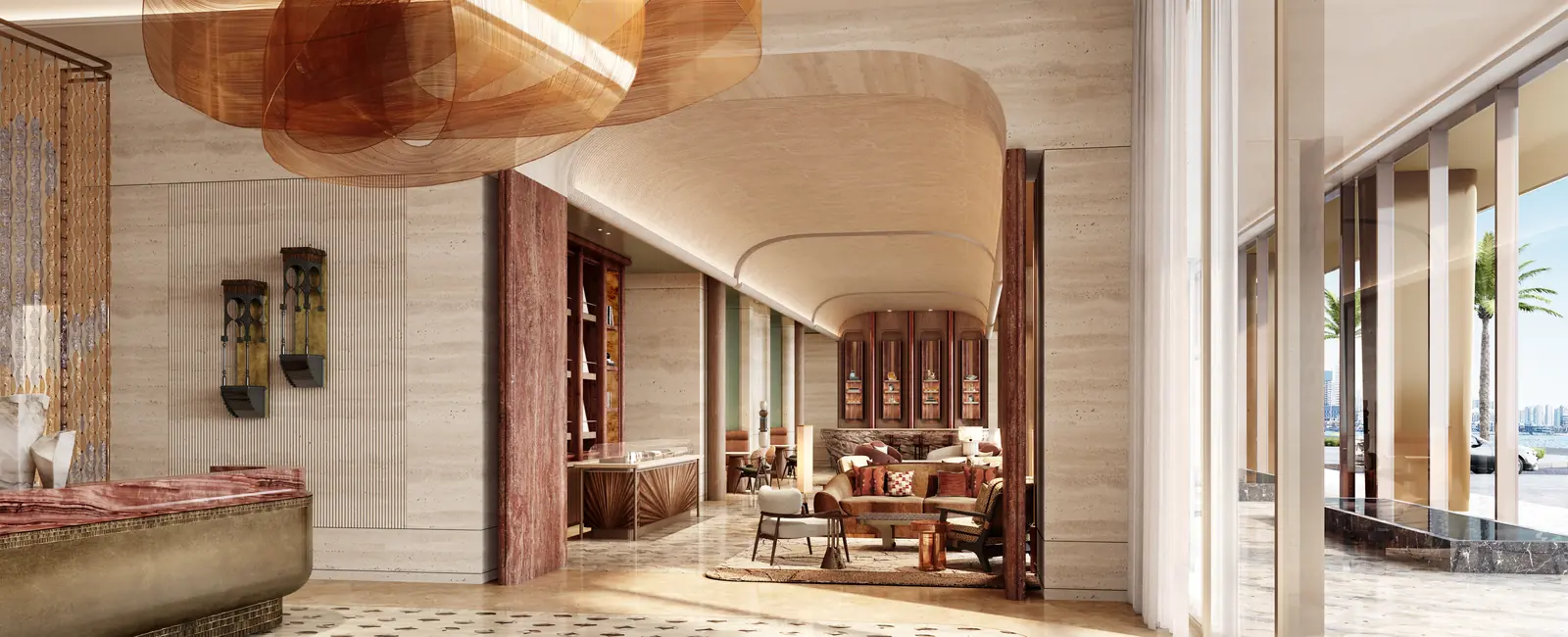 Jumeirah Residences lobby with travertine walls, curved ceiling and waterfront outlook