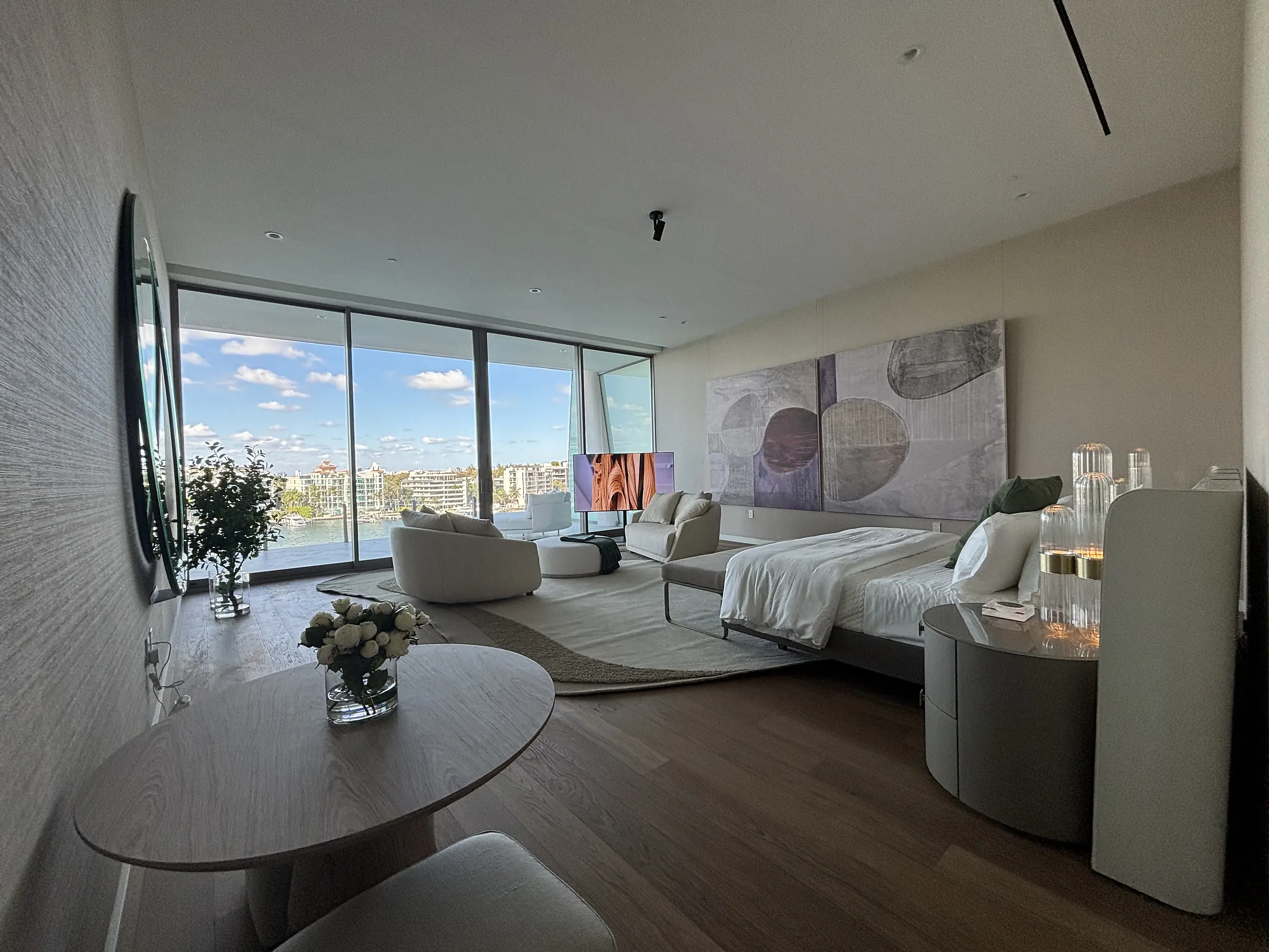 Vita Grove Isle penthouse bedroom suite with sitting area and waterfront views, Coconut Grove