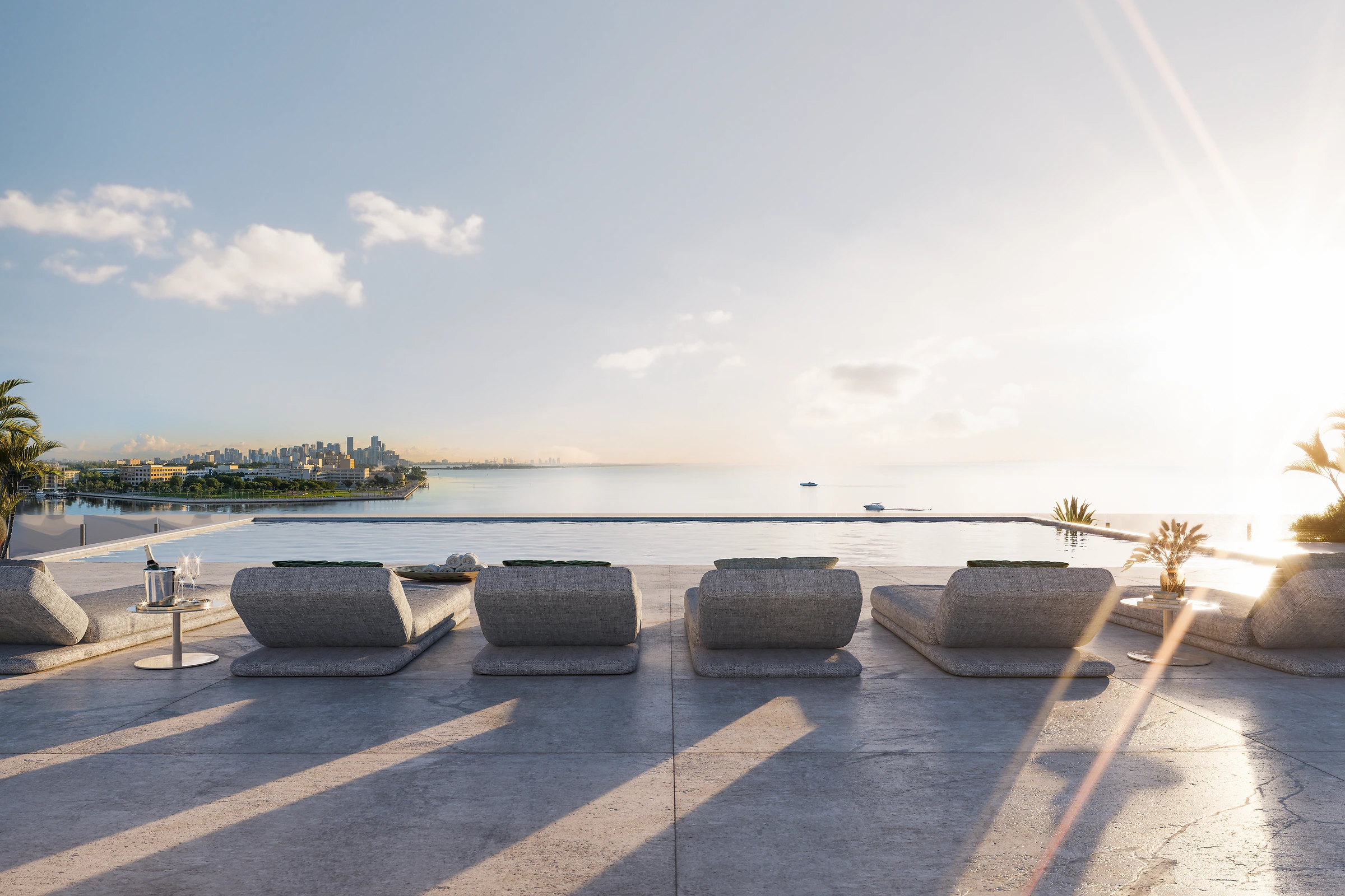 Vita Grove Isle penthouse private rooftop infinity pool at sunset over Biscayne Bay, Coconut Grove Miami