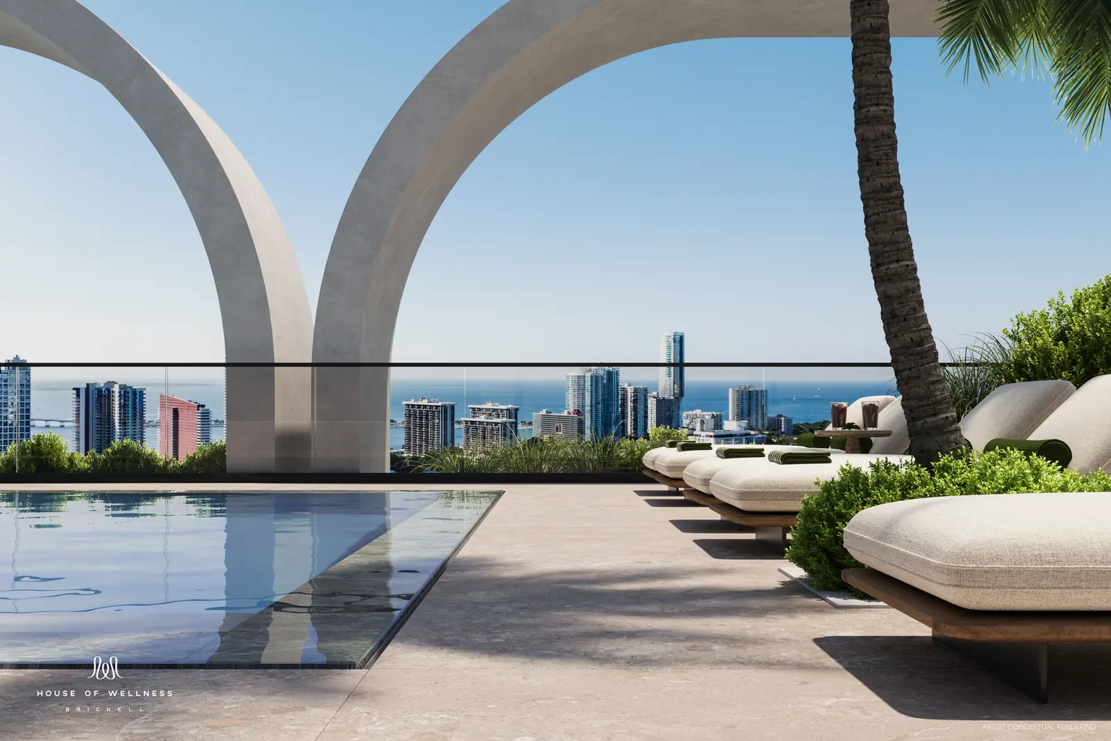 House of Wellness Brickell rooftop pool framed by concrete arches with skyline and ocean view, Miami