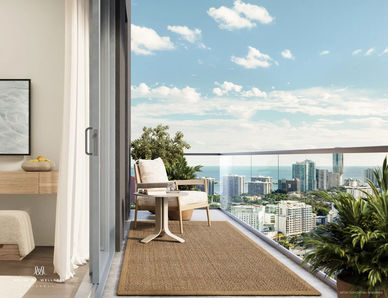House of Wellness Brickell residence balcony with lounge chair overlooking Brickell and the bay, Miami