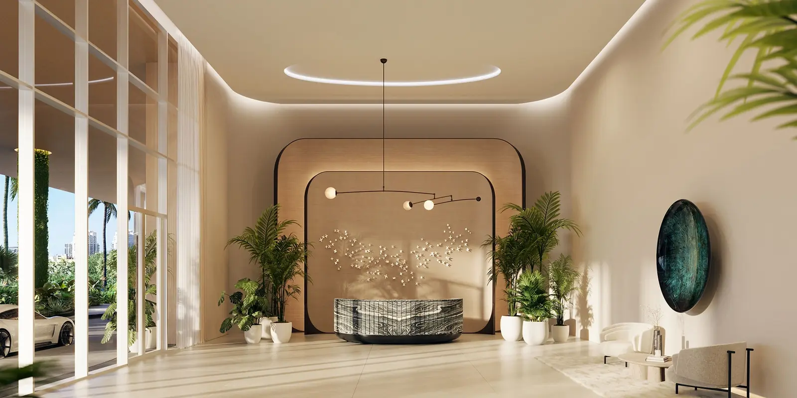 Viceroy Residences Fort Lauderdale double-height lobby with sculptural chandelier and curved reception desk