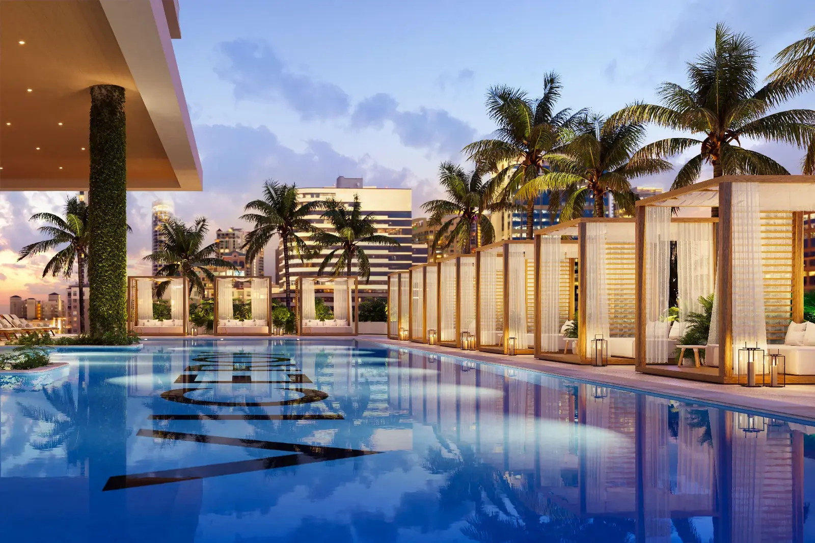 Viceroy Residences Fort Lauderdale resort pool deck with cabanas, daybeds and palms at dusk