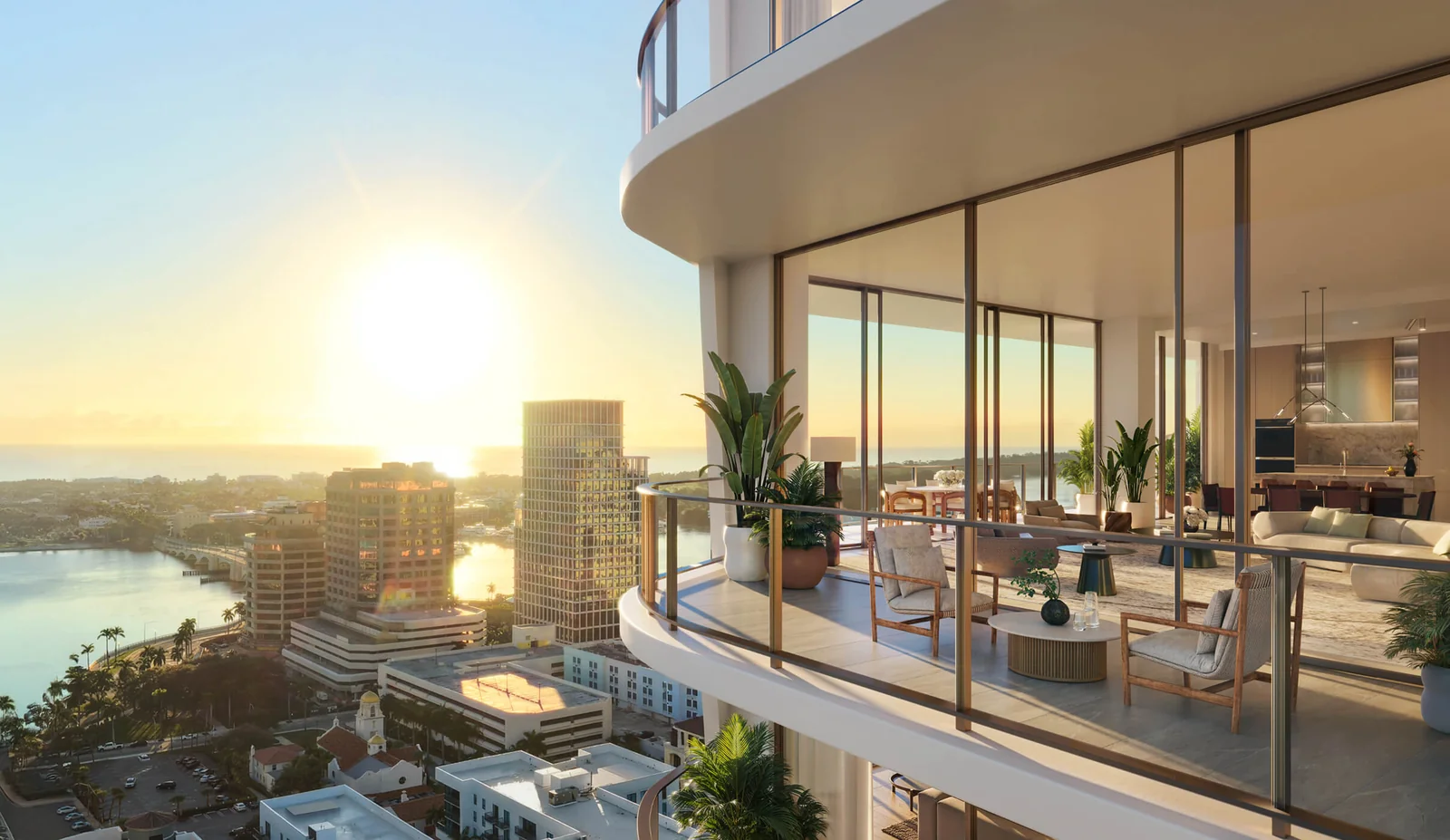 Banyan Tree Residences West Palm Beach corner terrace at sunset over the downtown skyline and Intracoastal Waterway