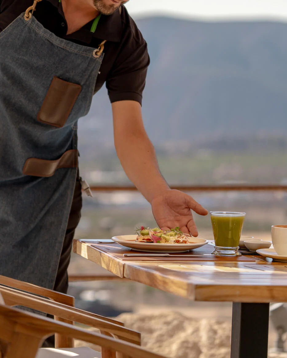 Banyan Tree Residences West Palm Beach terrace dining service on a sunlit private balcony