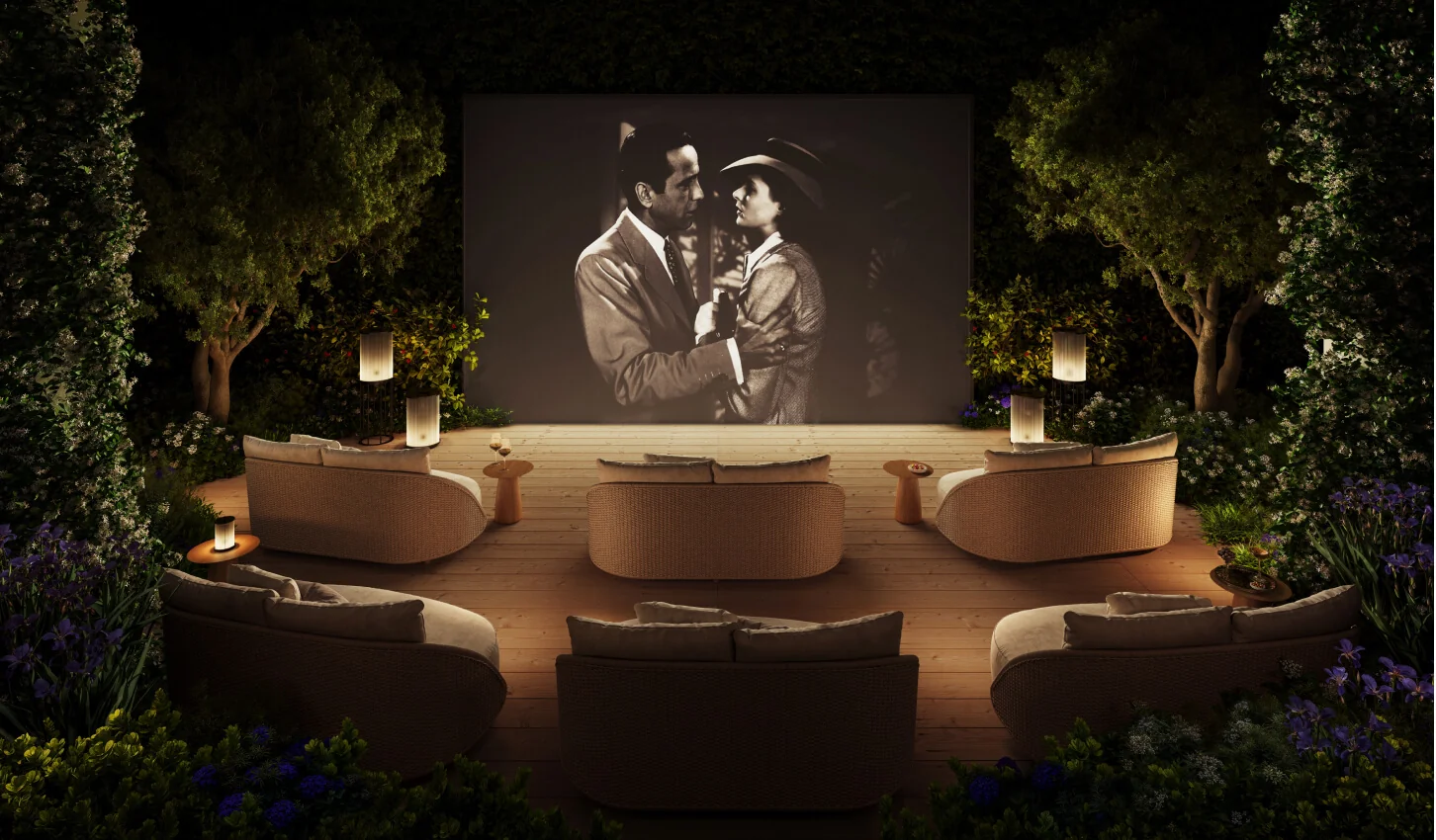Banyan Tree Residences West Palm Beach open-air cinema with curved lounge seating in a garden setting