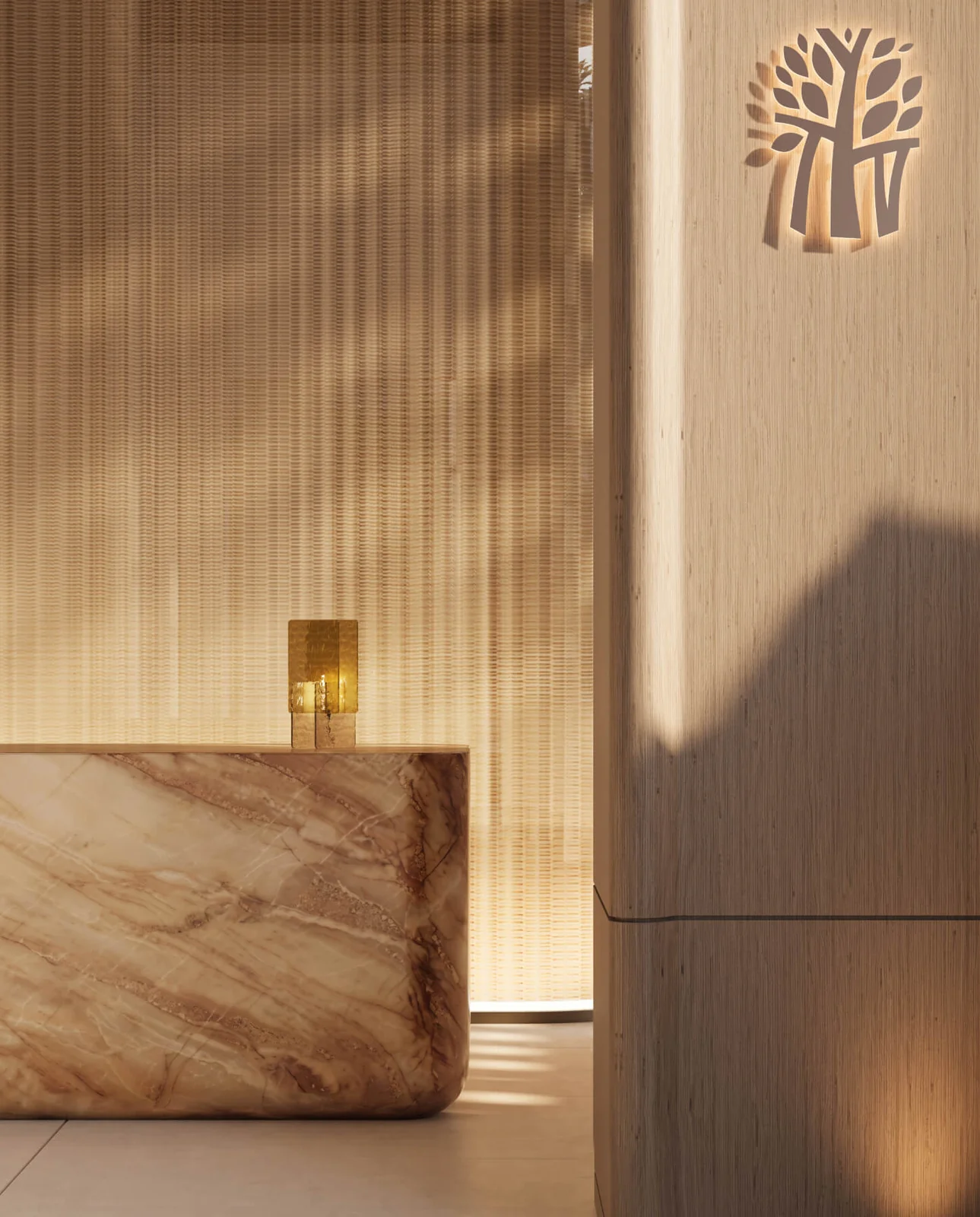 Banyan Tree Residences West Palm Beach spa reception desk in marble with the Banyan Tree emblem
