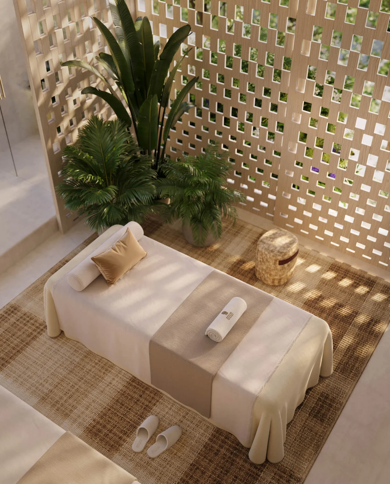 Banyan Tree Residences West Palm Beach spa treatment bed with palm planting and patterned screen wall