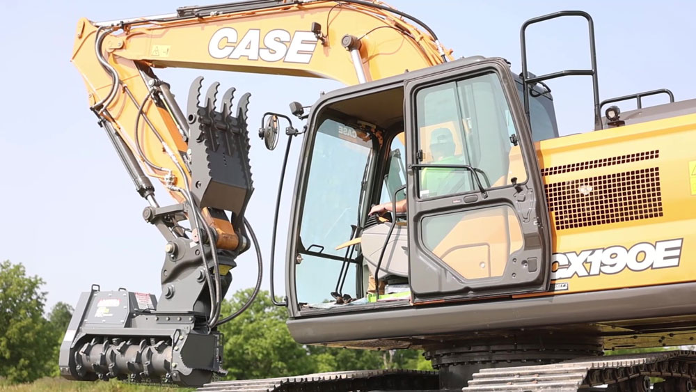 CASE excavator with a mulching attachment for land clearing