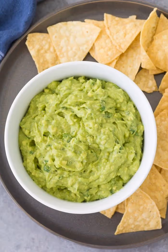 guacamole with tortilla chips on the side