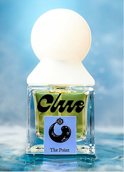 Clue Perfumery – The Point fragrance bottle with white spherical cap set against a blue water backdrop.