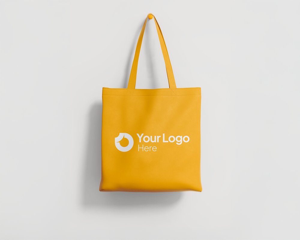 A yellow tote bag with "Your Logo Here."