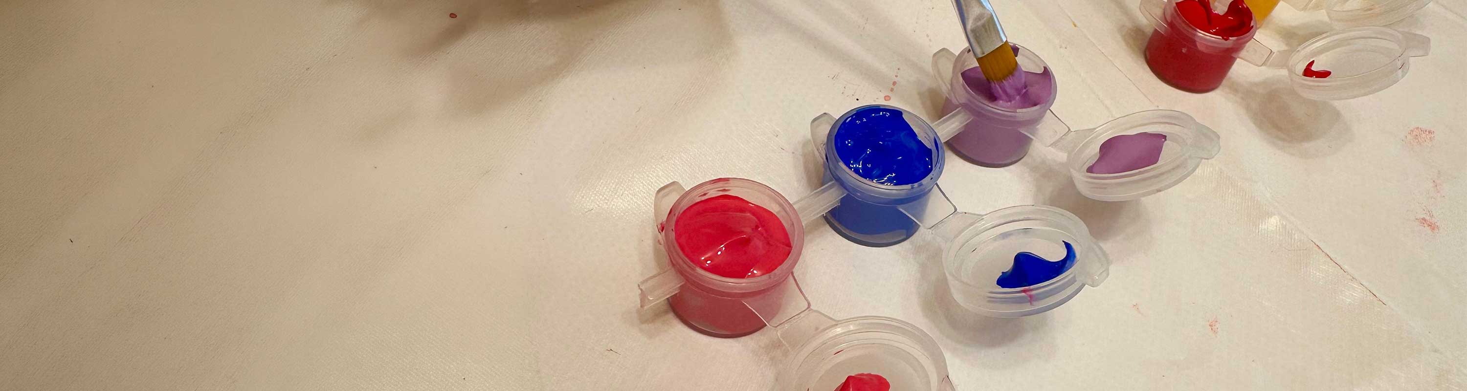 a collage image of a worker wearing a SensorZone tag, an Ai person detection camera, and a wheel loader