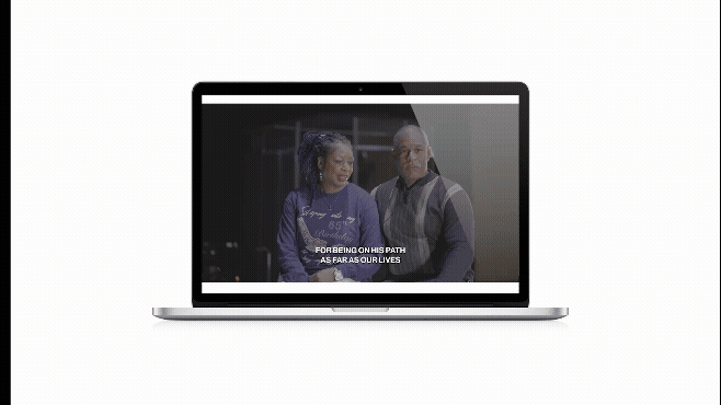 Hands arranging a quilt square with a blue star pattern on a white fabric background.