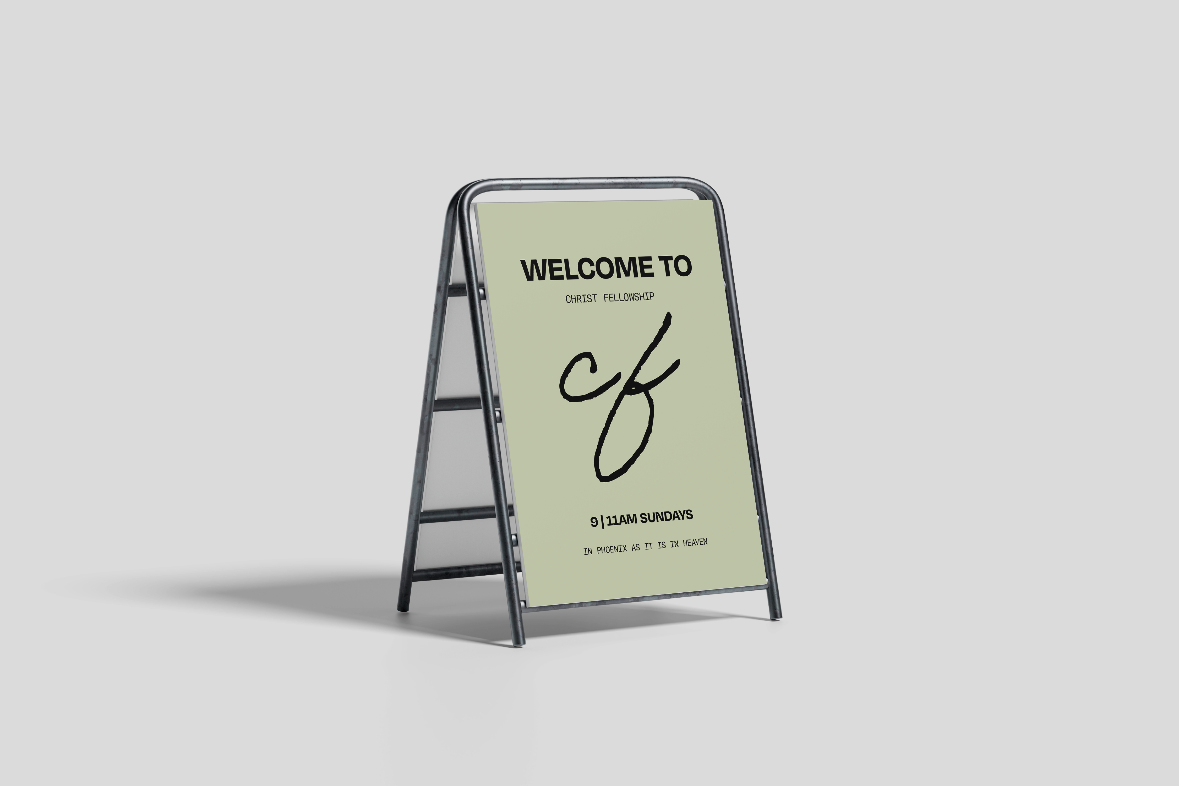 Green sandwich board sign with black text welcoming to Christ Fellowship, showing service times 9 and 11 AM Sundays in Phoenix.