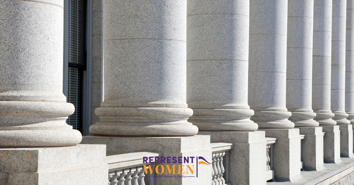Close-up of tall stone columns outside a government or legislative building, with the RepresentWomen logo and tagline displayed at the bottom center.