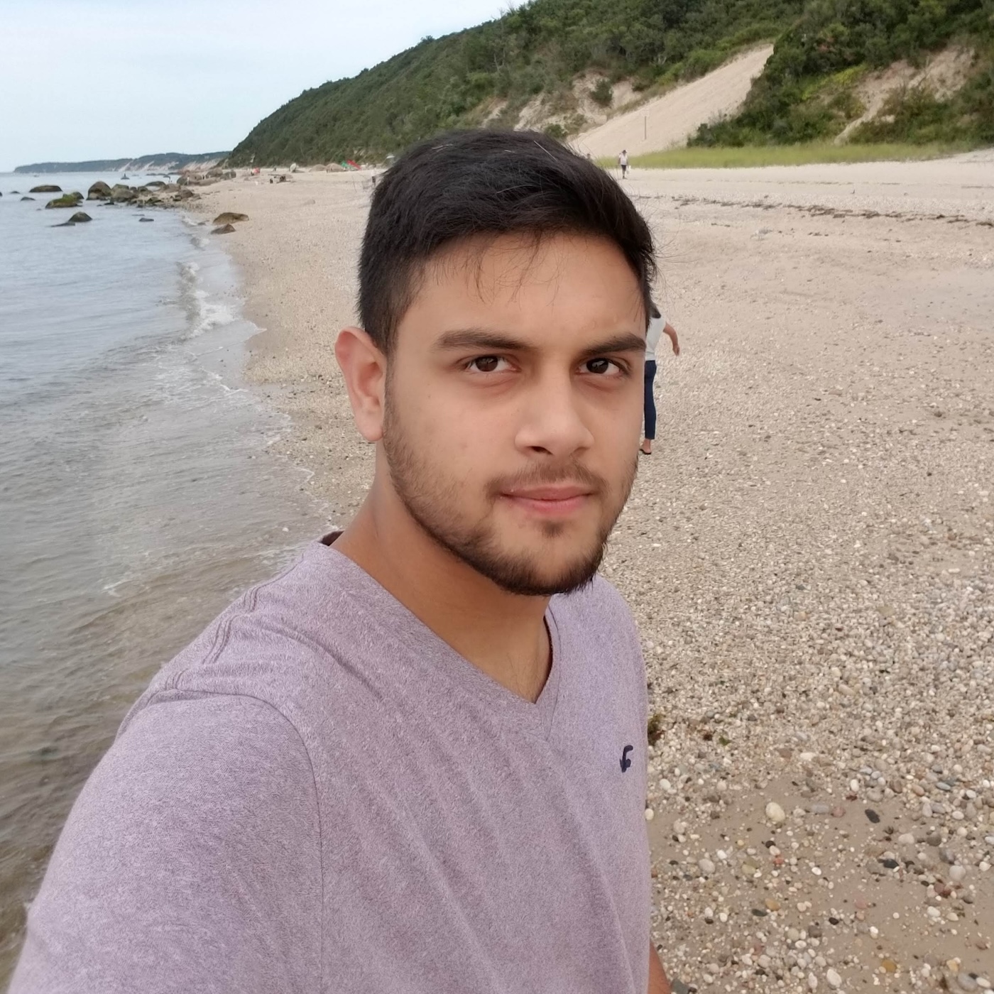 Tristan Persaud walking the beach