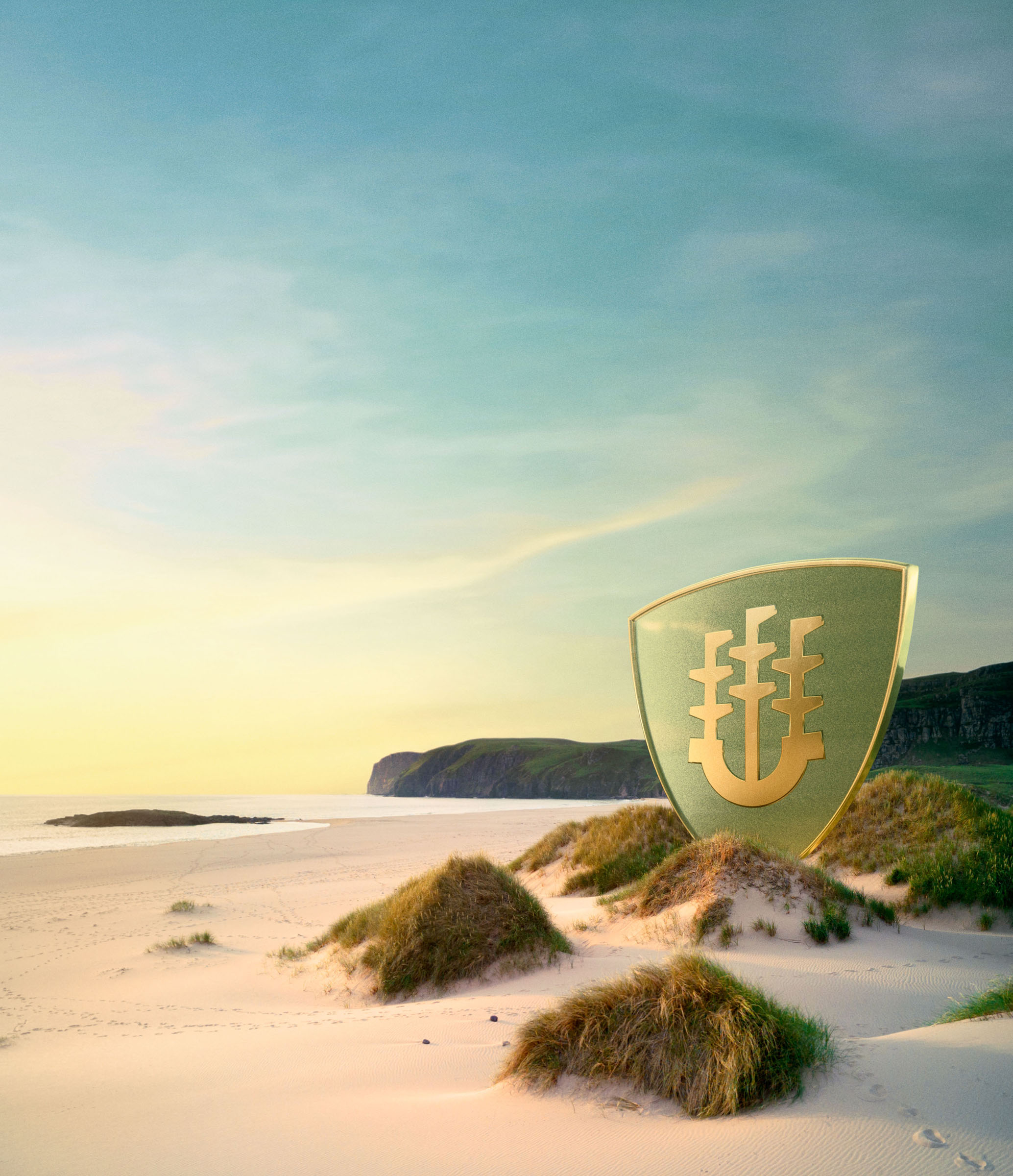 Shield emblem standing in coastal sand dunes beneath sunset sky, Sentry Investments campaign