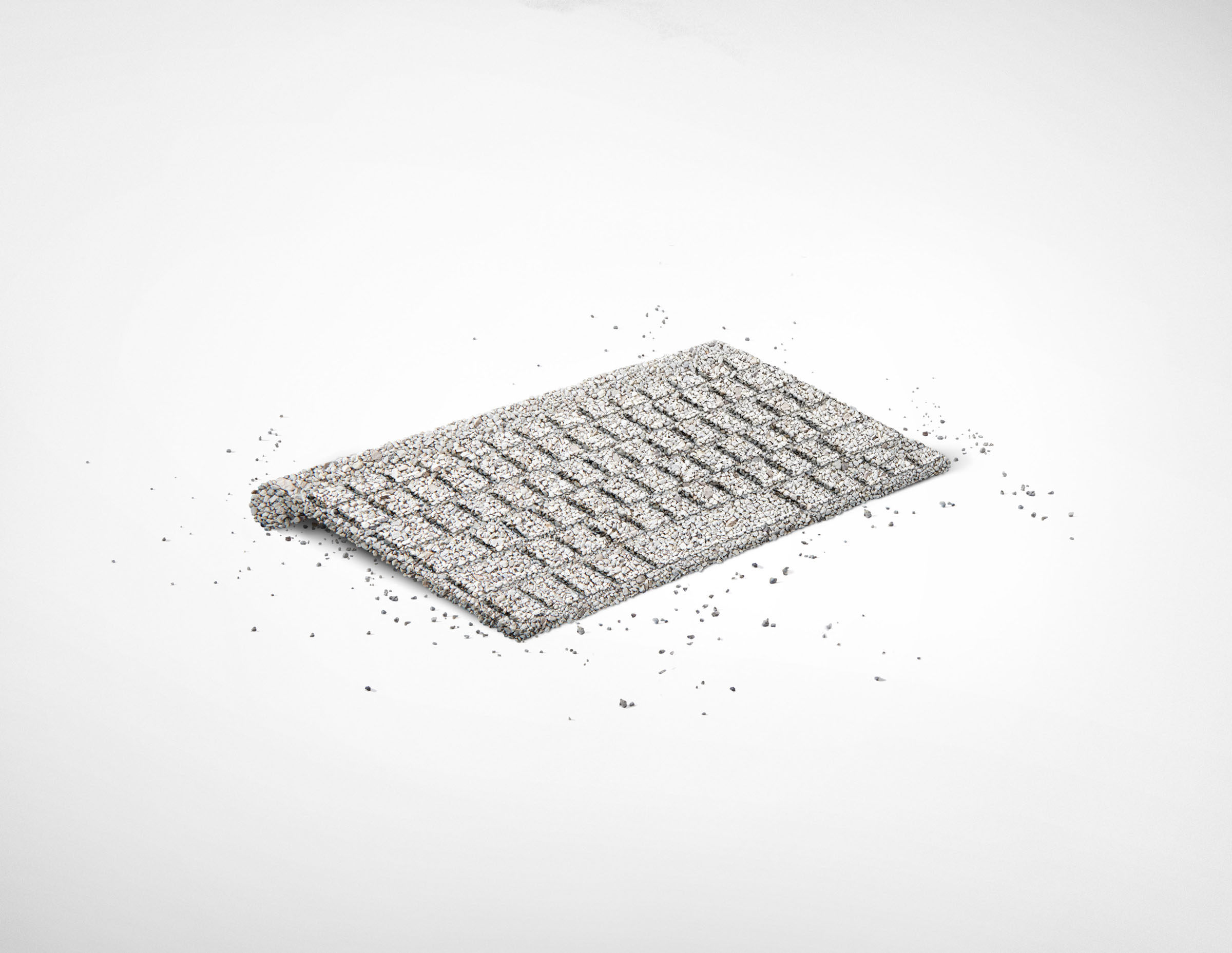 Computer keyboard sculpture made from cat litter on white background, Royal Canin campaign.