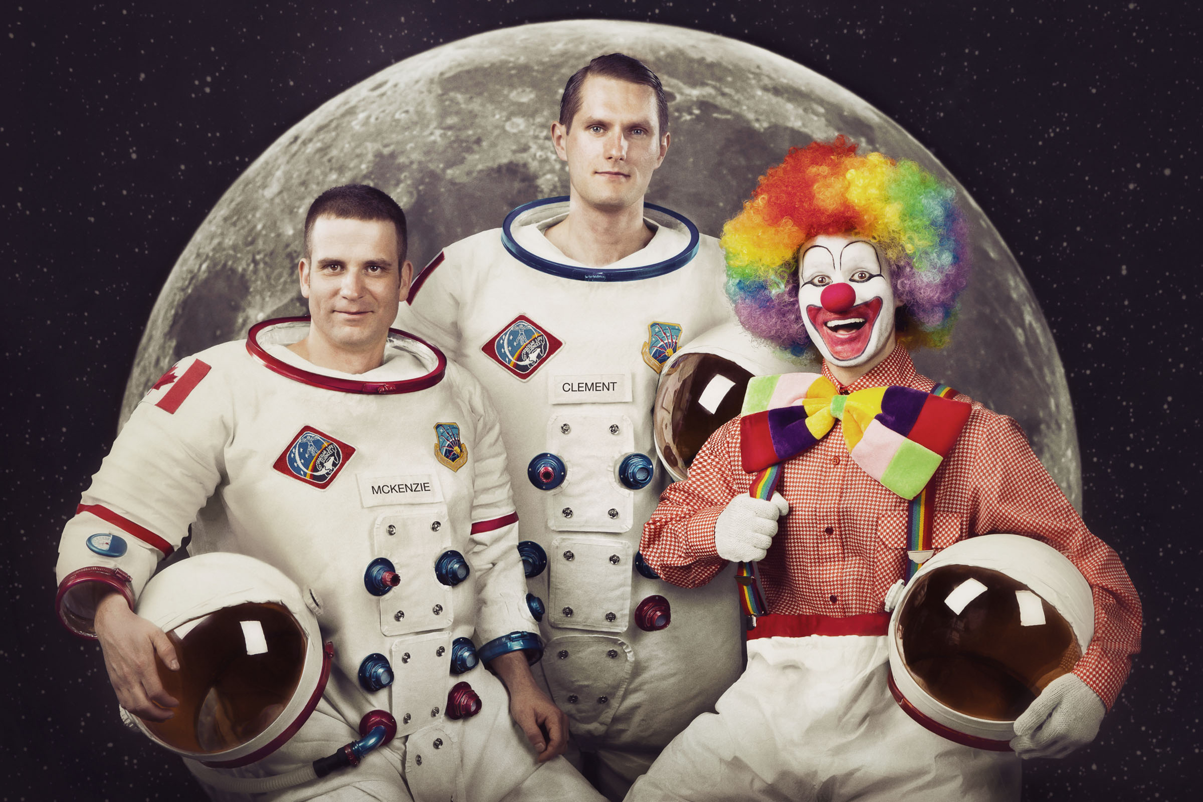 Astronauts and clown posing with space helmets in front of full moon backdrop, Employment Ontario campaign.