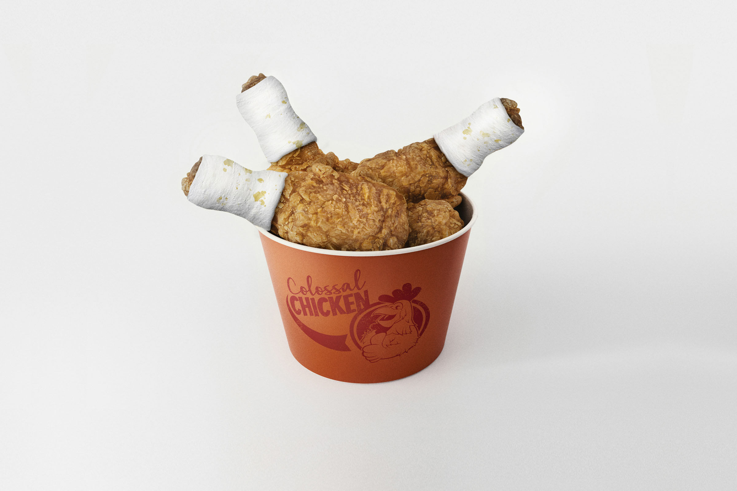 Bucket of fried chicken with bandaged drumsticks, World Animal Protection campaign.