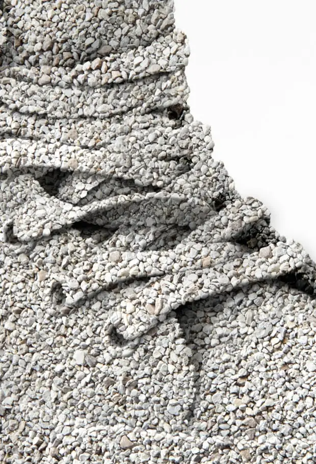 Cat litter sculpted into miniature mountain landscape in studio, Royal Canin campaign.