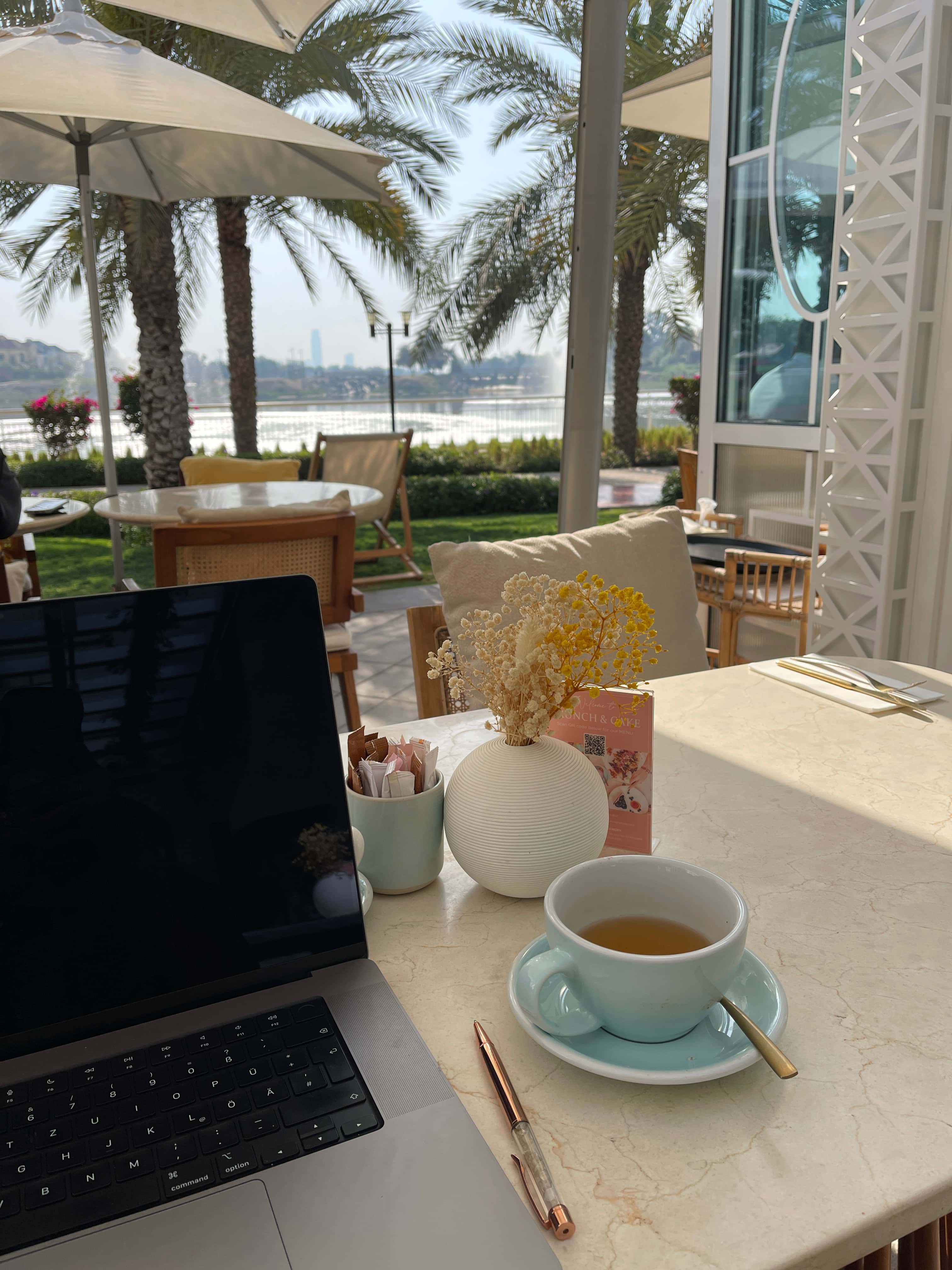 A car with an open trunk and suitcases are ready to be put in the car