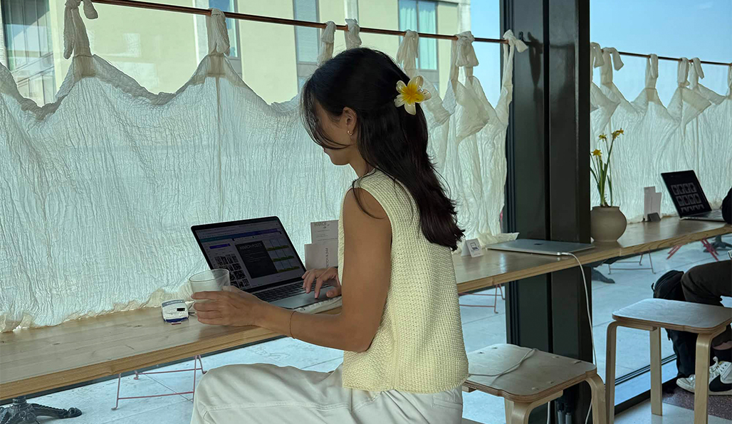 A beautiful pale pink house and a green palm tree