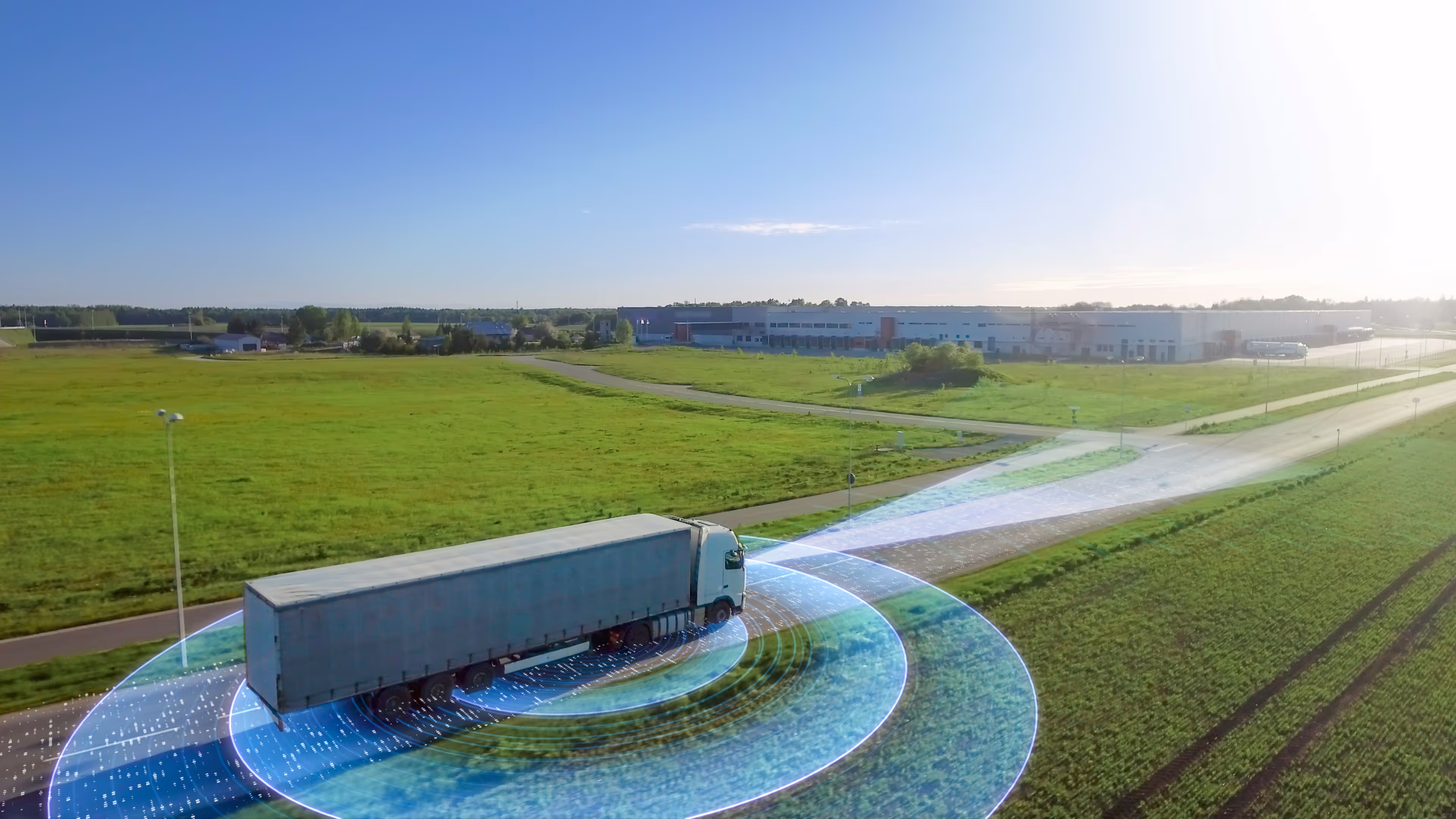 Truck driving on road with technology graphic surrounding it