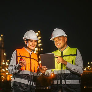 Two energy plant staff looking at tablet