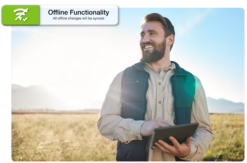 Man in a field on tablet with offline functionality call out