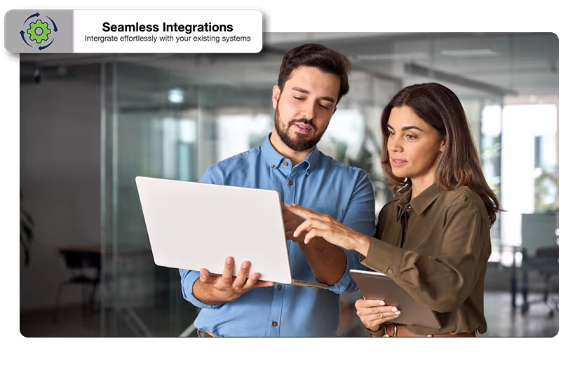 Male and female worker looking at a laptop, with seamless integrations call out graphic