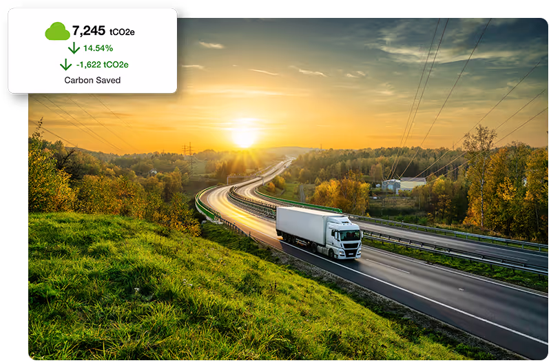 Freight truck driving long highway with carbon emissions saved call out graphic