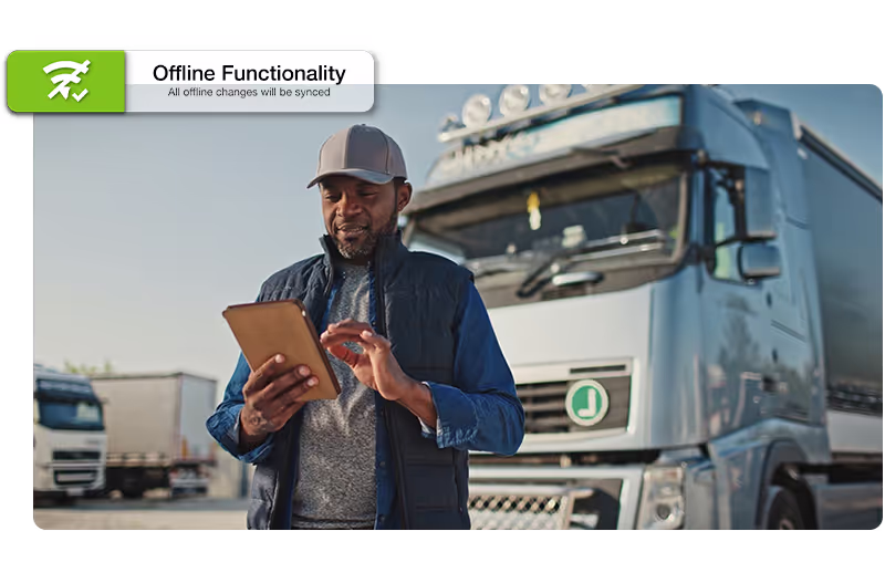 Male truck driver stood next to truck on tablet, with offline functionality call out graphic