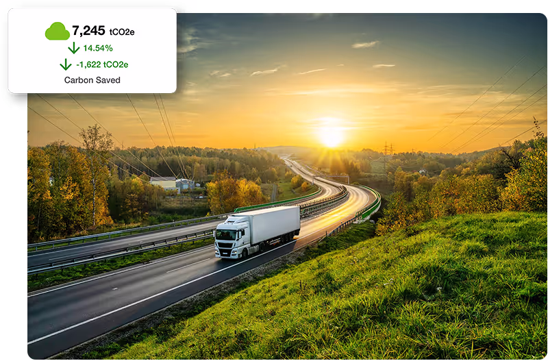 Freight truck driving on highway with emissions graphic call out