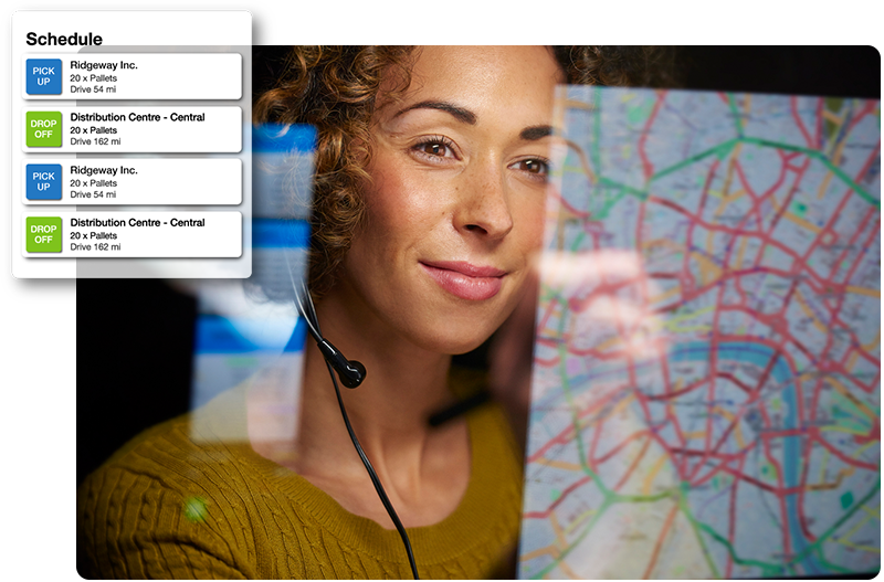 Dispatcher looking at map and driver schedule on computer