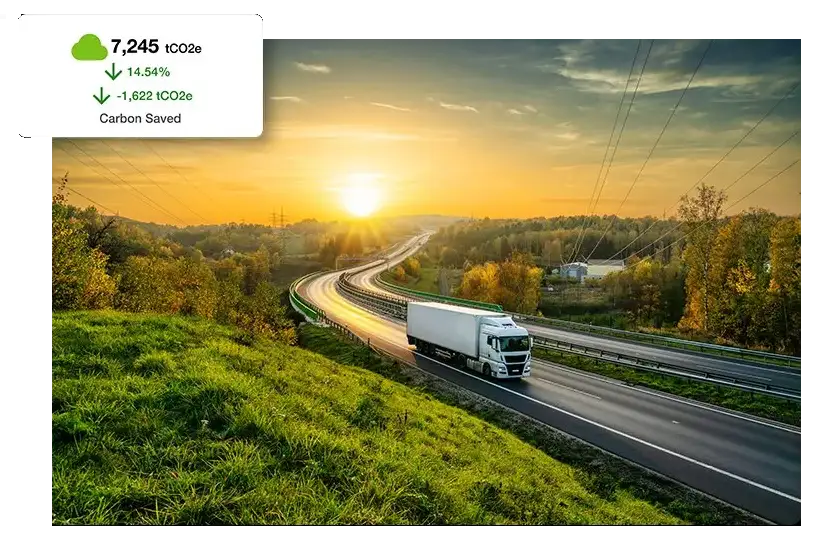 Freight truck driving on highway with carbon emissions call out graphic