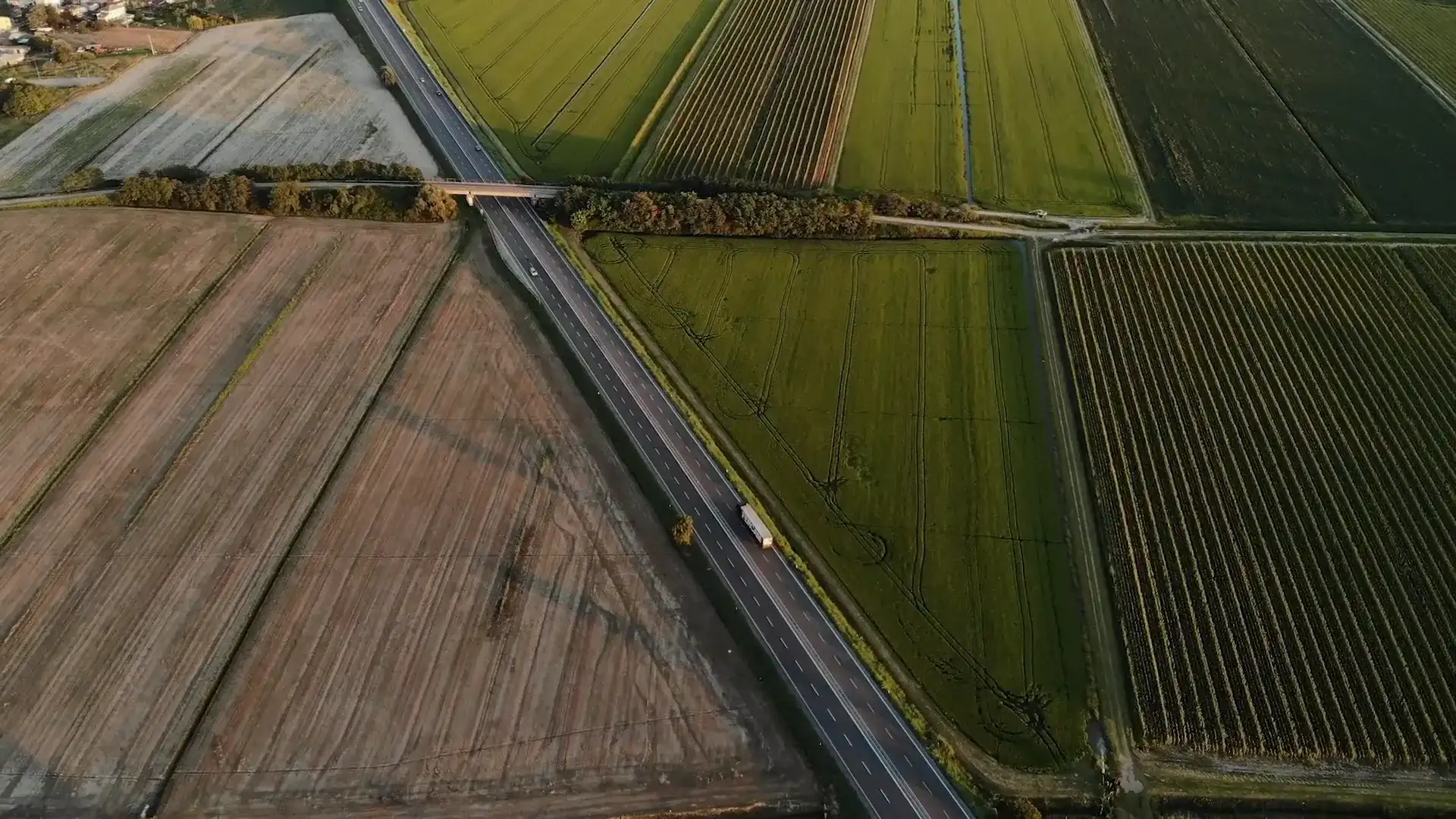 M2X and Farmlands logos over an aerial shot of farmland