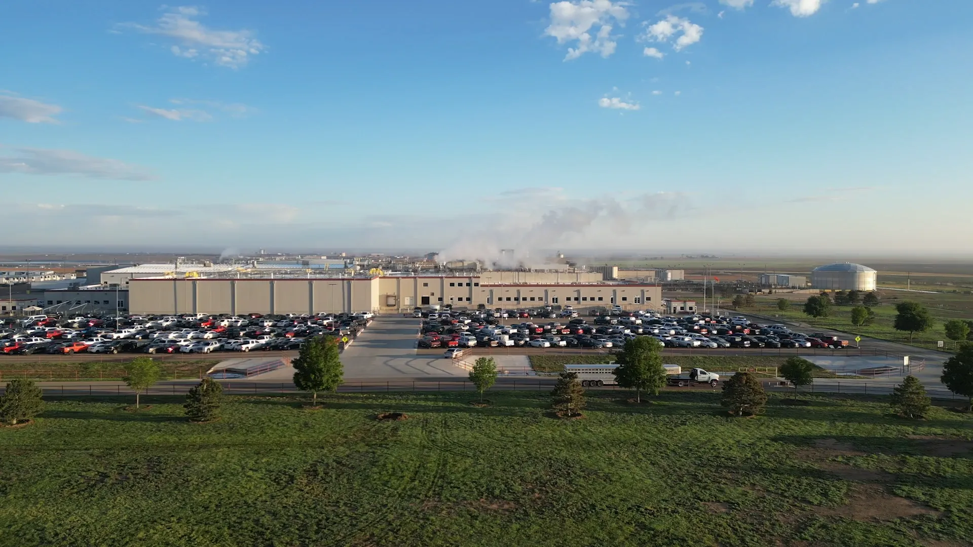 M2X and Caviness Beef Packers logos over a photo of a meat processing plant