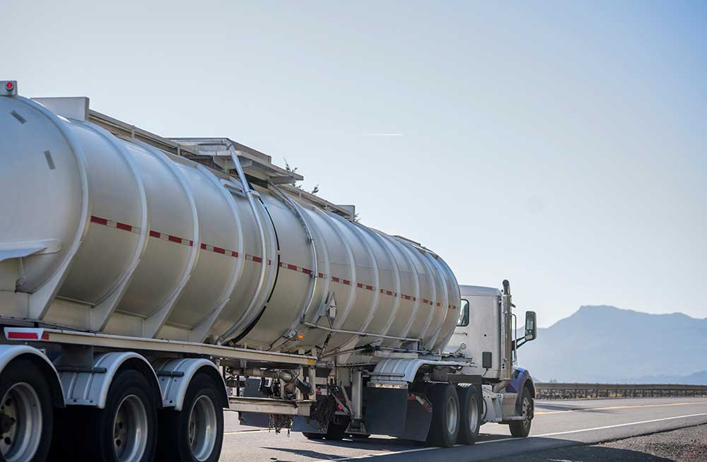 Liquid bulk tanker truck driving on highway