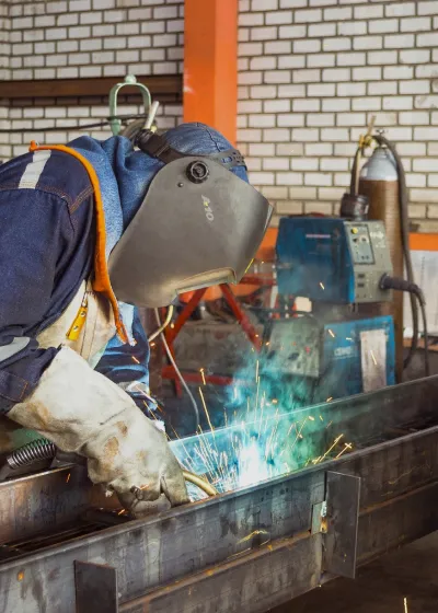 Welders working on steal column