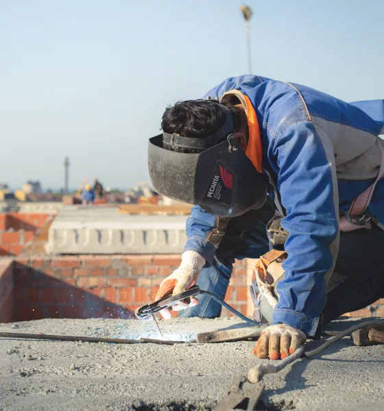 Welder working on project outside
